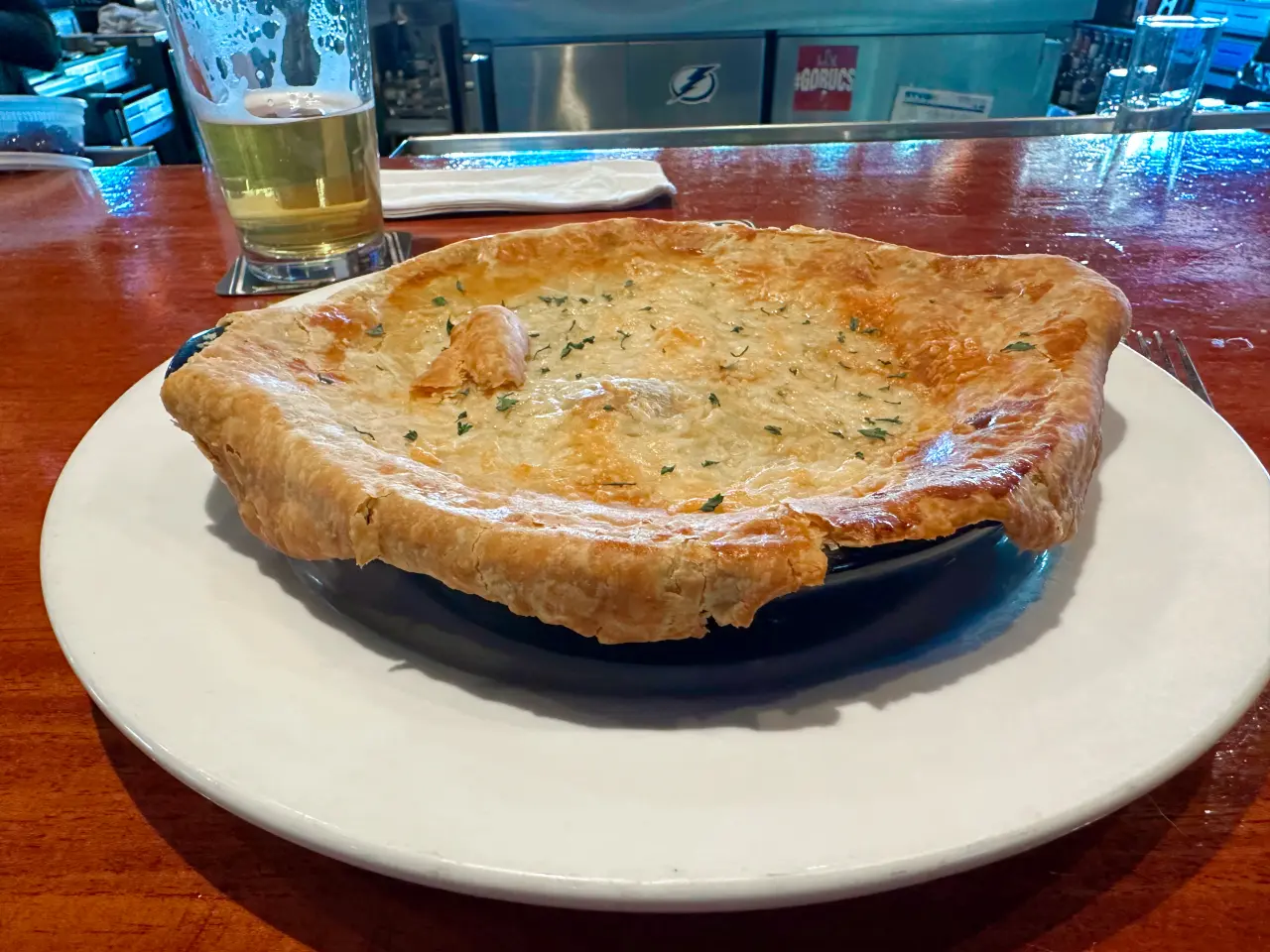 Photo of a chicken pot pie and beer