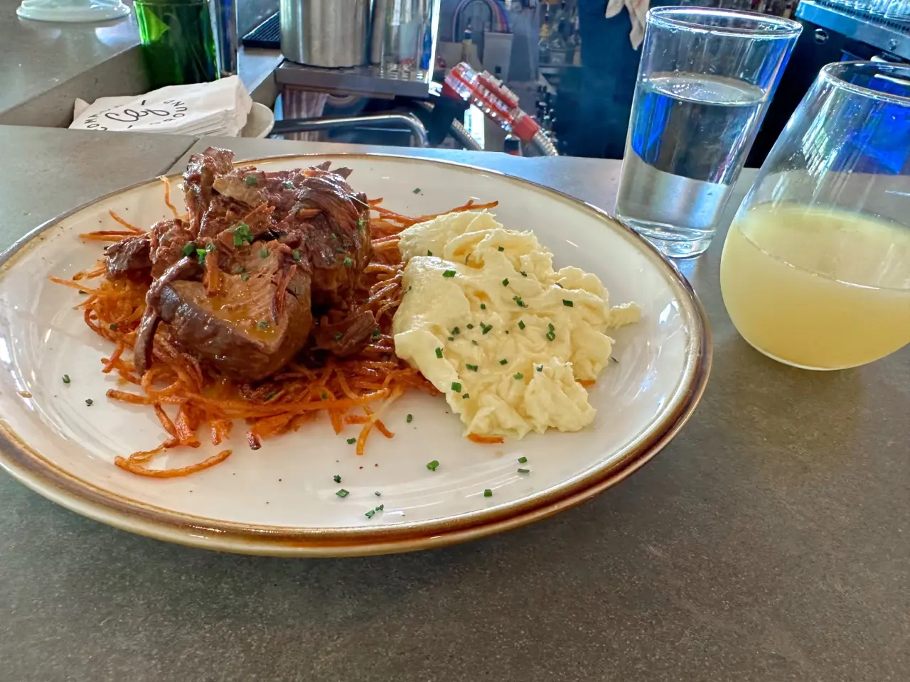 Photo of braised short ribs on hash browns