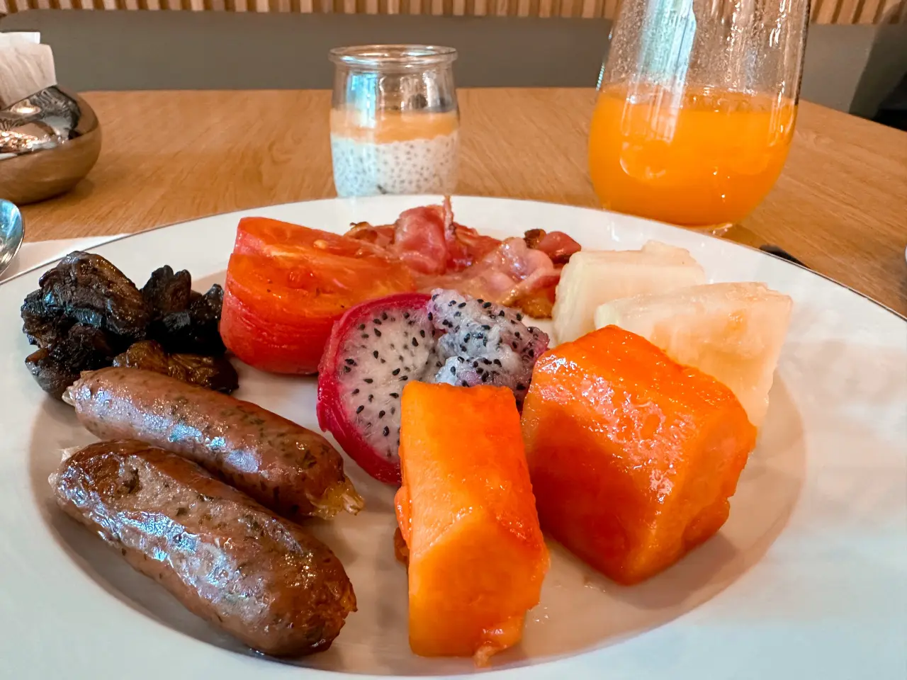 Photo of a plate of meat and fruit