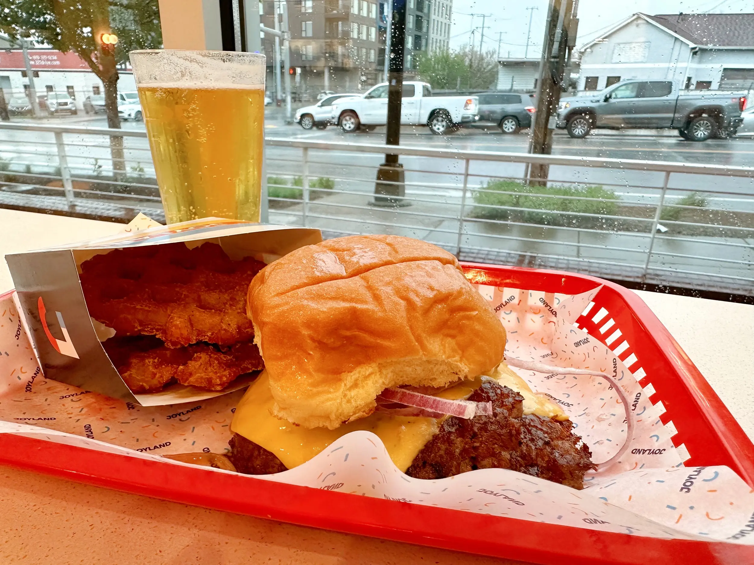 Photo of a deluxe burger and waffle hashbrowns