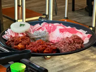 Photo of a combination of yet to be cooked Korean BBQ meats