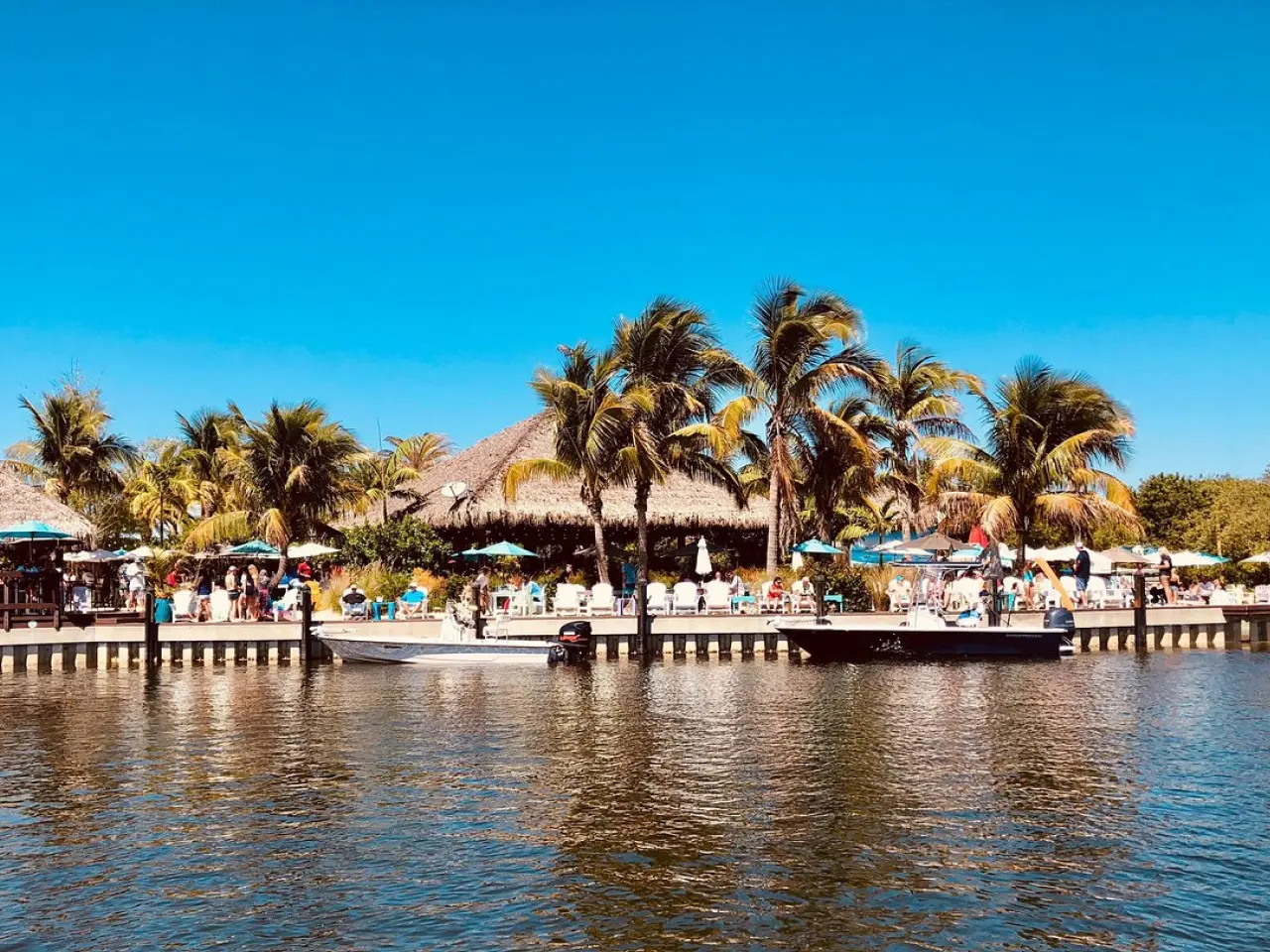 Photo of a tiki restaurant, shot from the water