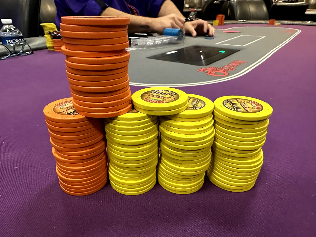 Photo of tournament chips on a poker table