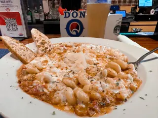 Photo of a baked cavatappi bolognese