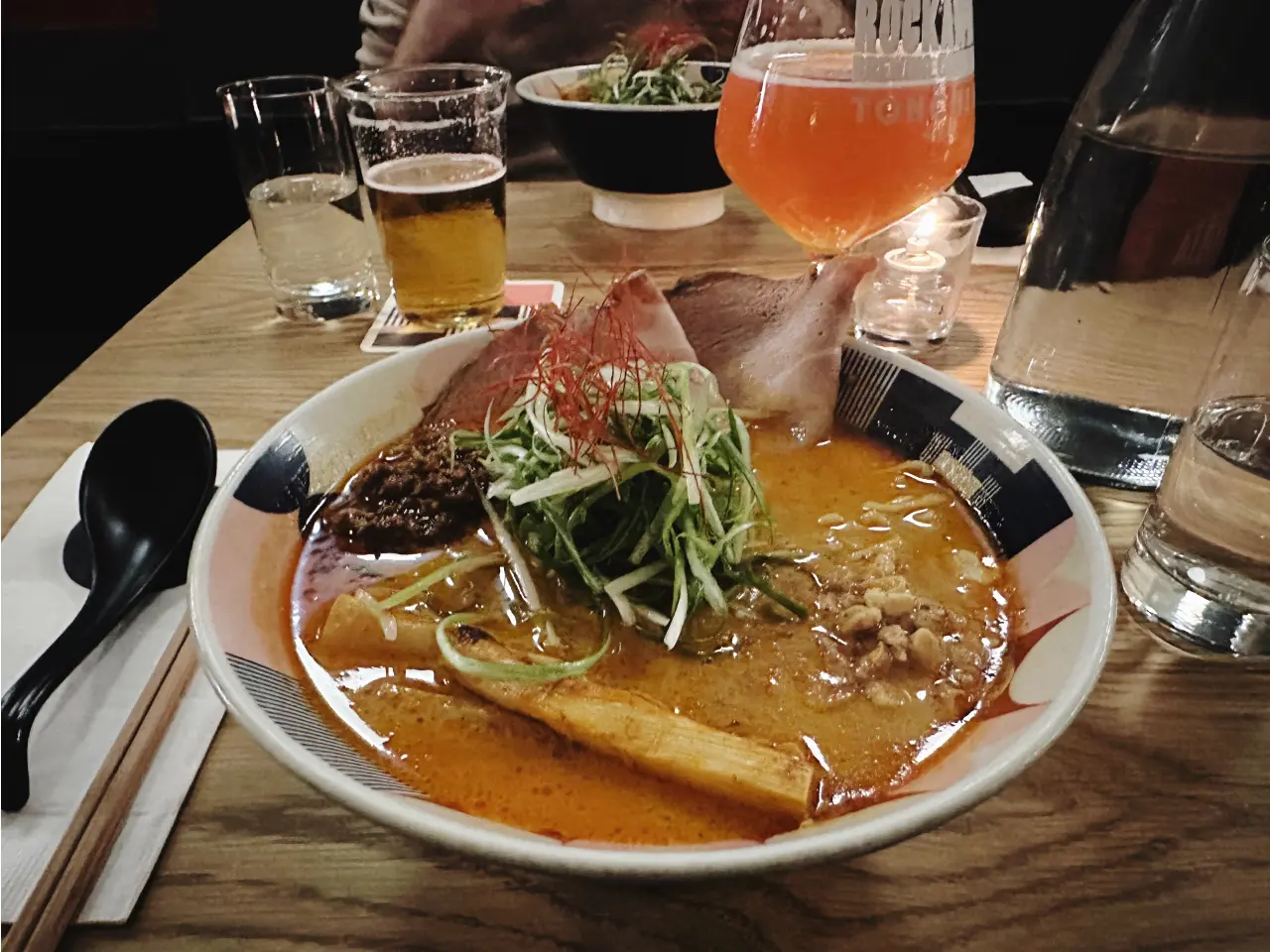 Photo of a bowl of Ramen and a beer